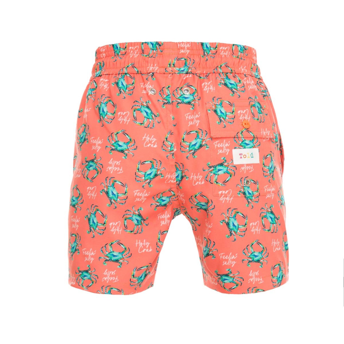 Peach-colored swim shorts with teal crab pattern on a white background