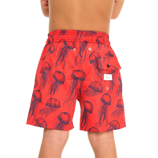 Red swim shorts with jellyfish pattern on a white background