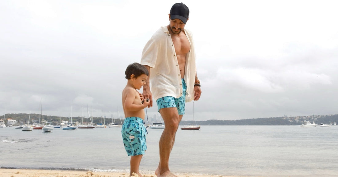 Father and son wearing colourful matching swimwear by Tolu Australia